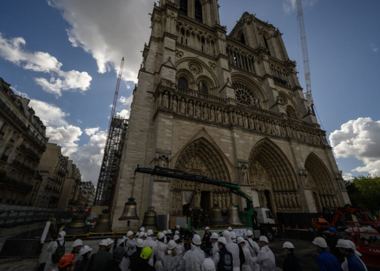Man Paraglides Off Notre-Dame Cathedral in Paris—and More Art News
