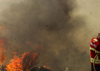 Wildfires rage in Europe as millions swelter under record heat