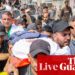 Mourners gather amid outrage over Israeli troops’ killing of journalists in Gaza – live updates | World news