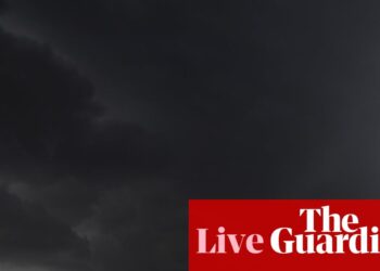 Australia news live: woman dead in powerful storm as landslide and flood warnings issued for Sydney | Australia news