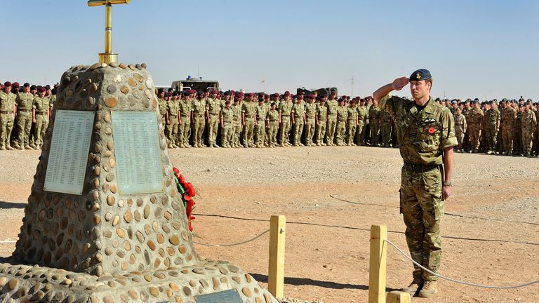 Prince William salutes a memorial to British soldiers killed in Afghanistan. Pic: Reuters