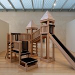 A reconstruction of a child's playground castle in red oak, with all the walkways and slide covered in boar hair bristles.