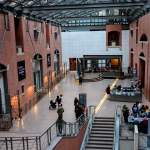 A museum atrium with people inside it.