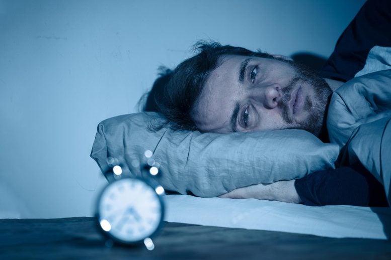 Sleepless Young Man Awake at Night Insomnia