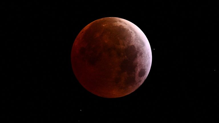 A full moon is seen during a "Blood Moon" total lunar eclipse, in Caracas, Venezuela, March 14, 2025. REUTERS/Gaby Oraa
