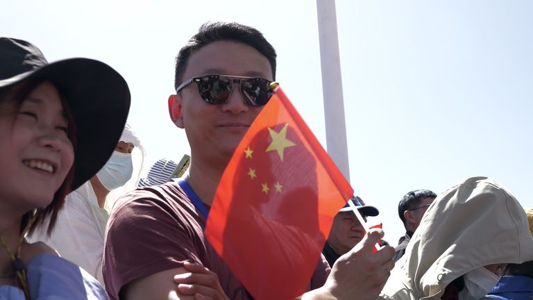A man with a Chinese flag