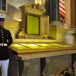 An honor guard stands next to the original copies of the Declaration of Independence, the Constitution, and the Bill of Rights, 2001, at the National Archives in Washington, D.C.