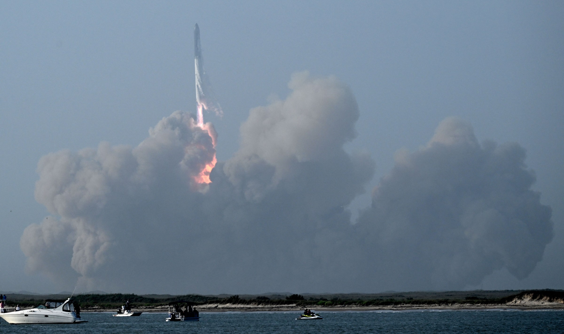 The SpaceX Starship lifts off from the launchpad during a flight test from Starbase in Boca Chica, Texas, on April 20, 2023. The Starship capsule had been scheduled to separate from the first-stage rocket booster three minutes into the flight, but separation failed to occur and the rocket blew up.