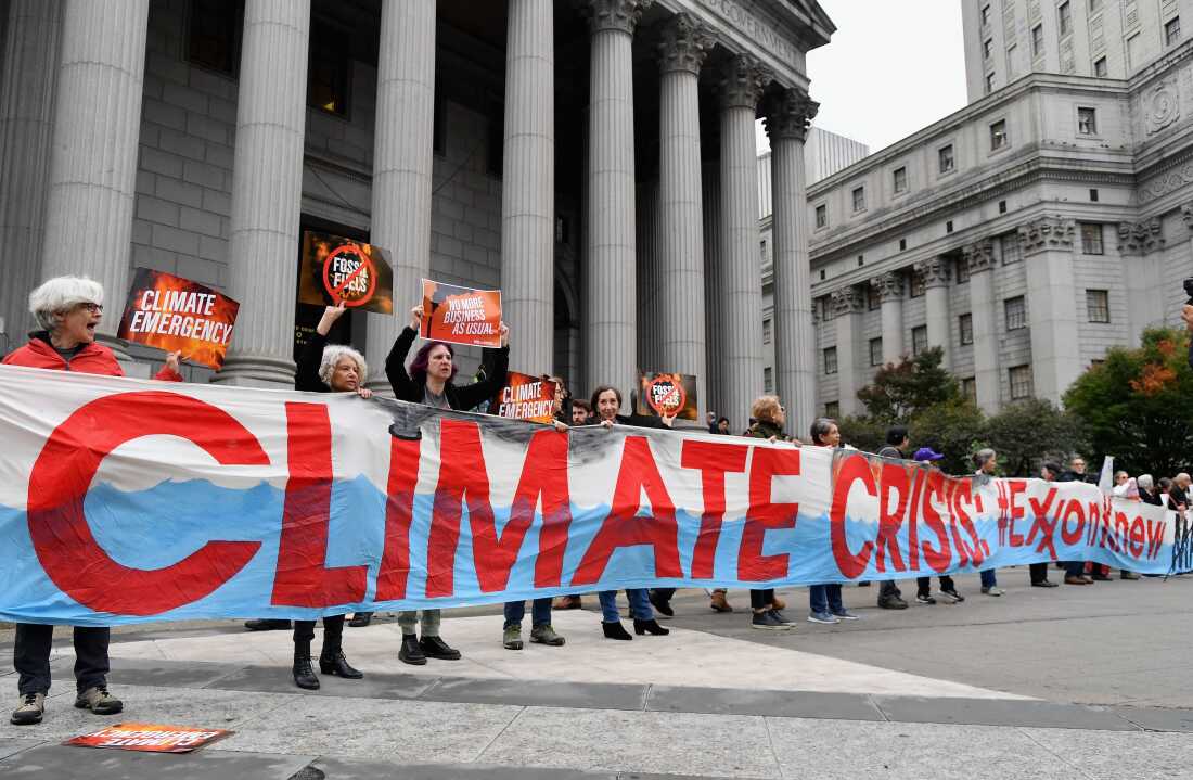 Climate activists protest on the first day of an ExxonMobil trial outside the New York State Supreme Court building in 2019 in New York City. Justice Barry Ostrager of the New York State Supreme Court ultimately found that the New York Attorney General's Office failed to prove that ExxonMobil broke the law.