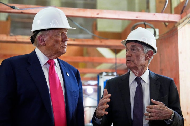 President Donald Trump listens as Federal Reserve Chairman Jerome Powell speaks during a visit to the Federal Reserve, Thursday, July 24, 2025, in Washington. (AP Photo/Julia Demaree Nikhinson)