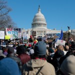 A group of people protesting in front of the White House.