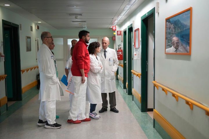 Professor and surgeon Sergio Alfieri, right, second from left, who headed the team who treated Pope Francis during his hospitalisation, talks with his team before an interview with the Associated Press at the Gemelli polyclinic hospital in Rome, Saturday, March 29, 2025. (AP Photo/Alessandra Tarantino)
