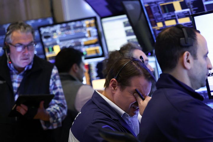 Traders work on the floor of the New York Stock Exchange (NYSE) at the opening bell in New York City, on April 3, 2025. (Photo by CHARLY TRIBALLEAU/AFP via Getty Images)