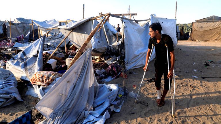 Palestinians inspect the damage at the site of an overnight Israeli strike  in Khan Younis.
Pic: Reuters
