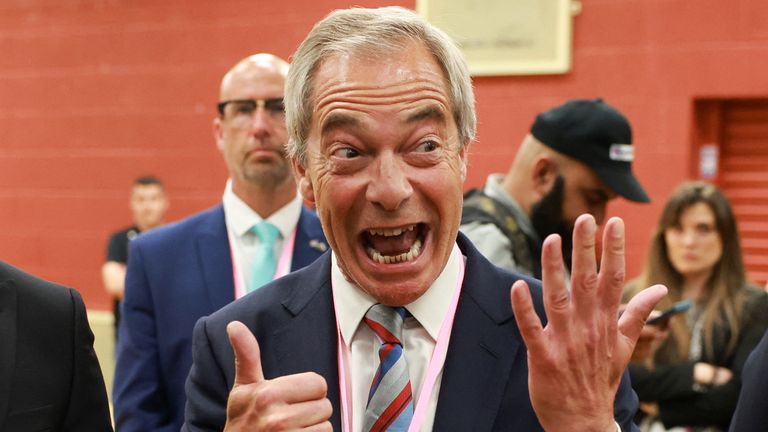 Nigel Farage holds up six fingers to indicate the six votes his party's candidate won by in the Runcorn and Helsby by-election.
Pic: Reuters