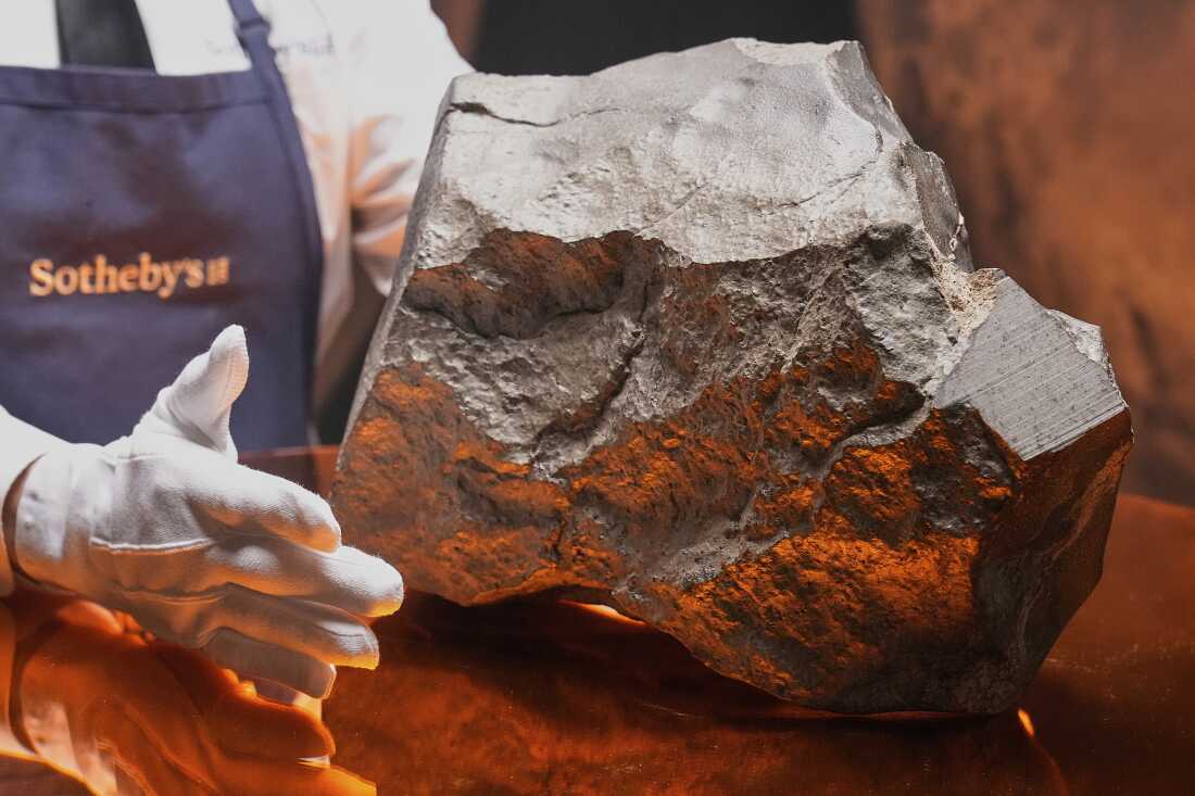 A Martian meteorite, weighing 54.388 lbs. (24.67 kg), said to be the largest piece of Mars on Earth, estimated at $2 - 4 million, is displayed at Sotheby's, in New York, Wednesday, July 9, 2025, part of their Geek Week auction, July 16, 2025. (AP Photo/Richard Drew)