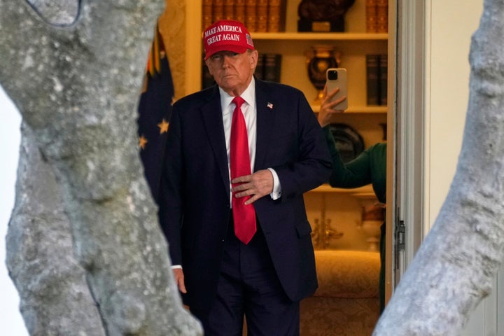 President Donald Trump walks from the Oval Office to depart on Marine One on the South Lawn of the White House in Washington, Feb. 28, 2025. (AP Photo/Ben Curtis, File)