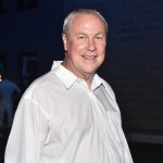 A man in a white button-down shirt.