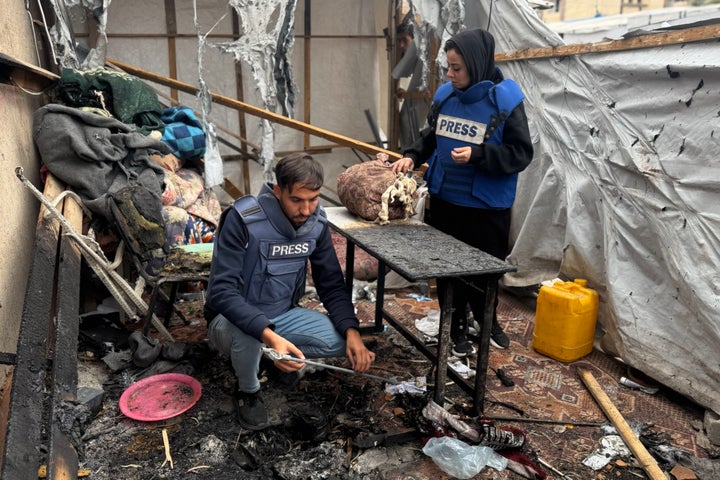 Palestinian journalists inspect the damage of a media tent bombed by Israeli forces in Khan Younis, Gaza on April 7, 2025.