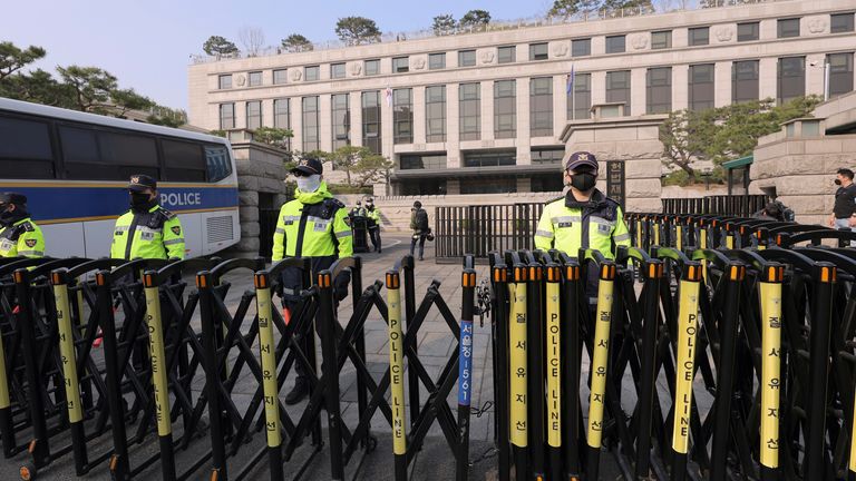 The Constitutional Court is under heavy police security guard ahead of the announcement of the impeachment trial. Pic: AP