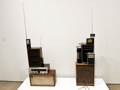 Two sculptures of various analog technologies stacked on top of each other.