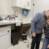 Joe Walsh embraces his wife, Karen, in a medical office.
