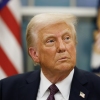 President Trump appears in the Oval Office on Monday with a U.S. flag behind him.