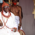 The King, known as Oba of Benin, Omo NOba Uku Akpolokpolo, Ewuare II, react while receiving repatriated artifacts that was looted from Nigeria over 125 years ago by the British military force in Benin City, mid-western, Nigeria, on February 19, 2022. - The two artifacts, which include a bronze cockerel and a bust, were part of the bronzes, ivories that were looted by British soldiers in 1897 in Benin kingdom, Edo State, Nigeria. (Photo by Kola Sulaimon / AFP) (Photo by KOLA SULAIMON/AFP via Getty Images)