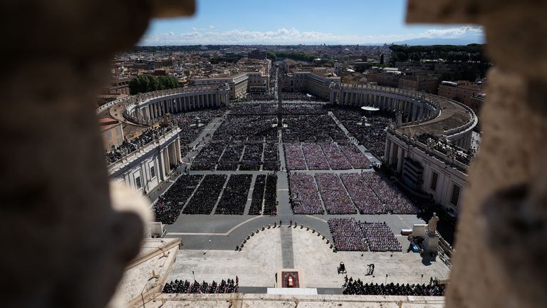 People attend the funeral Mass of Pope Francis at the Vatican, April 26, 2025. REUTERS/Yara Nardi