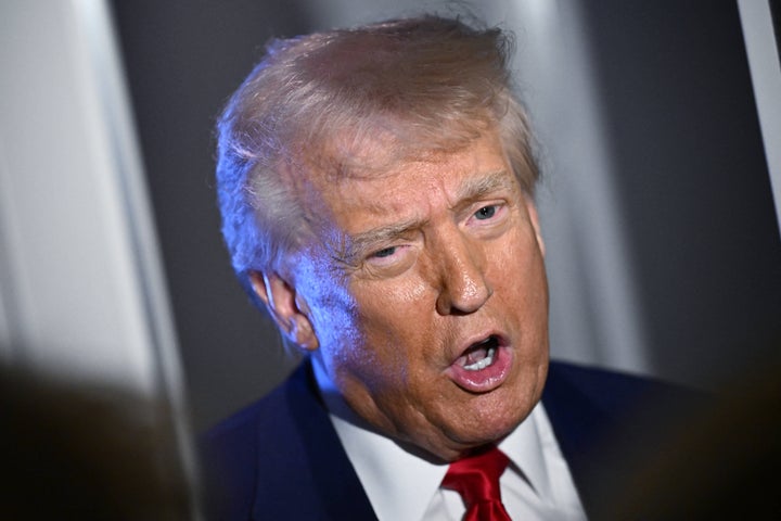 President Donald Trump speaks to reporters on board Air Force One on April 3, 2025.