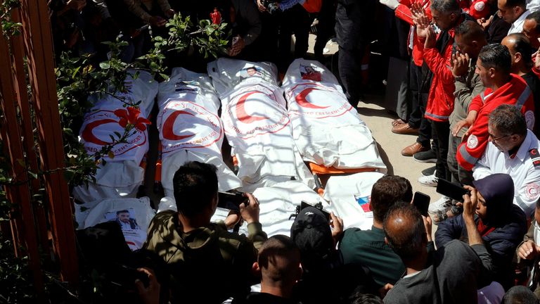 Palestinians gather around a body as they mourn medics, who came under Israeli fire while on a rescue mission, after their bodies were recovered, according to the Red Crescent, at Nasser hospital in Khan Younis in the southern Gaza Strip March 31, 2025. REUTERS/Hatem Khaled
