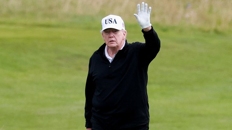 U.S. President Donald Trump waves on the golf course at Trump Turnberry resort in Turnberry, Scotland, Britain, July 26, 2025. REUTERS/Phil
