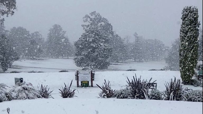 Snow blankets the grass at a Golf Club, in Armidale, New South Wales, Australia, August 2, 2025, in this screengrab obtained from social med